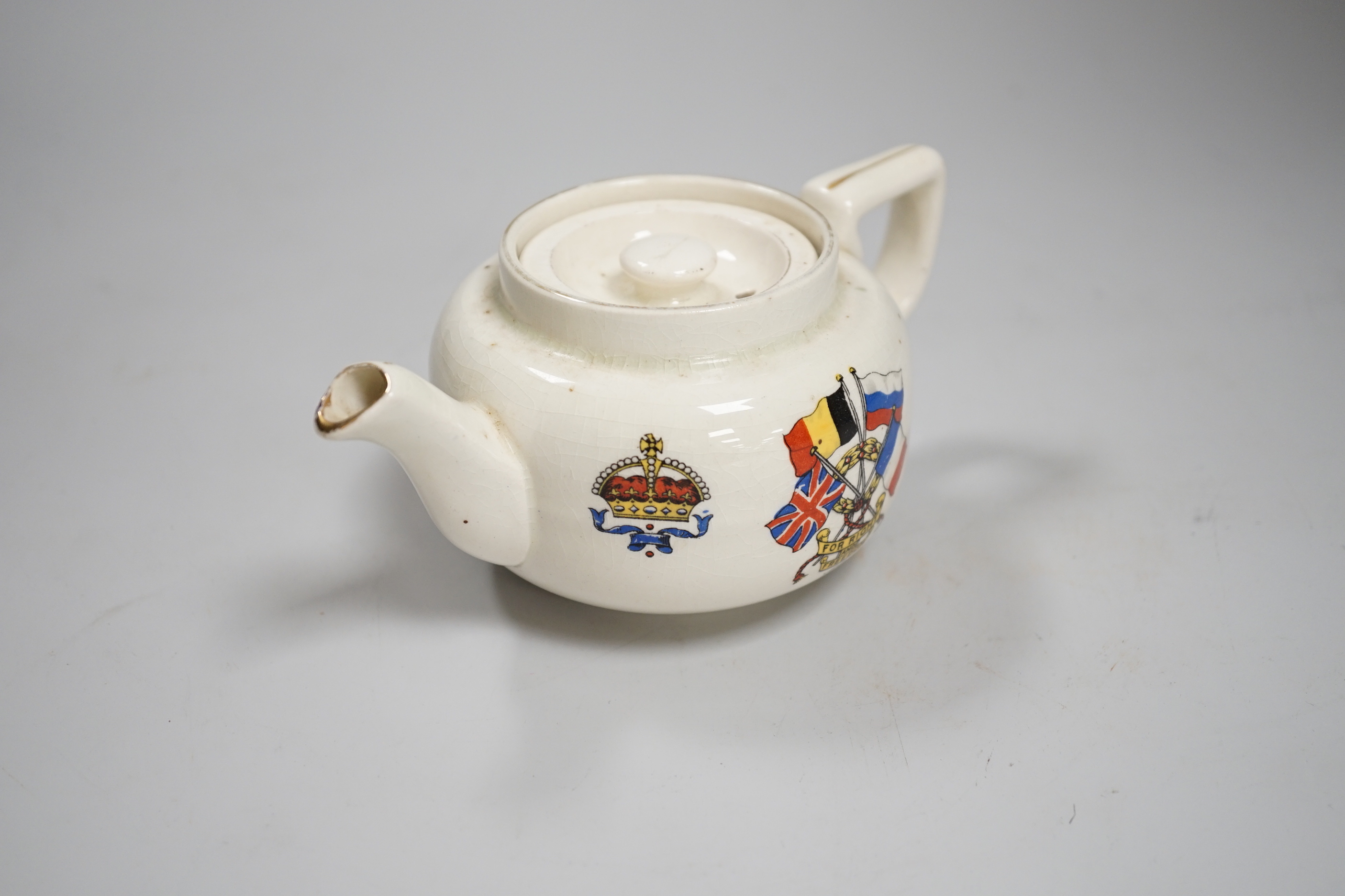 A WWI commemorative teapot with ‘For Right and Freedom’ motto and allied flags, 16cm wide